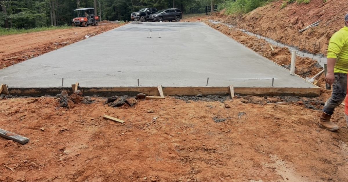 Freshly poured concrete slab with wood edge forms still in place